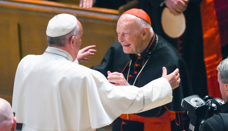 FILE - In this Sept. 23, 2015 file photo, Pope Francis reaches out to hug Cardinal Archbishop emeritus Theodore McCarrick after the Midday Prayer of the Divine with more than 300 U.S. Bishops at the Cathedral of St. Matthew the Apostle in Washington. Allegations that the most respected U.S. cardinal repeatedly sexually abused both boys and adult seminarians has raised questions about who in the Catholic Church hierarchy knew, and what Pope Francis is going to do about it. If the accusations against Cardinal Theodore McCarrick bear out, will Francis revoke his title of cardinal, sanction him to a lifetime of prayer or even defrock him, the expected sanction if McCarrick were a mere priest? 