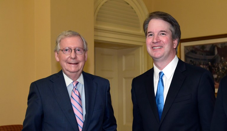 Senate Majority Leader Mitch McConnell of Ky., left, poses for a photo with Supreme Court nominee Brett Kavanaugh.
