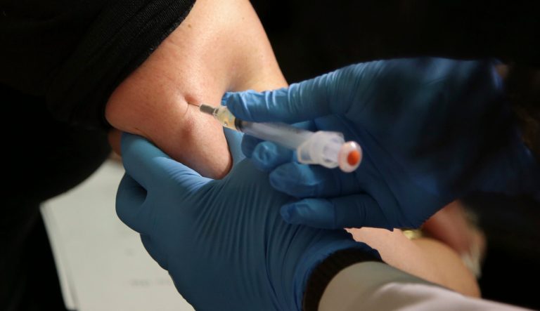 In this March 27, 2019, file photo, a woman receives a measles, mumps, and rubella vaccine at the Rockland County Health Department in Pomona, N.Y.