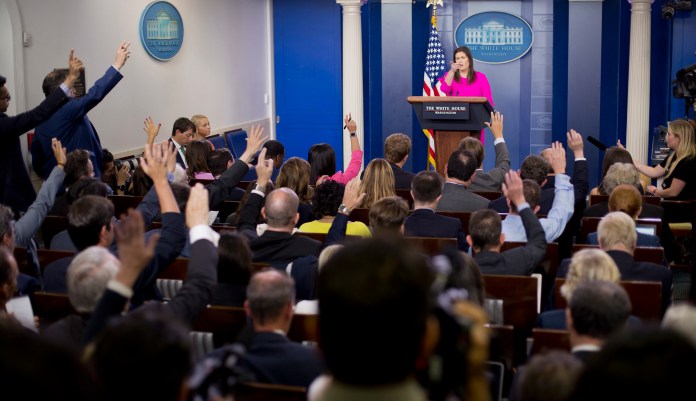 White House press secretary Sarah Huckabee Sanders gestures while speaking to the media during the daily briefing in the Brady Press Briefing Room of the White House, Monday, July 23, 2018.