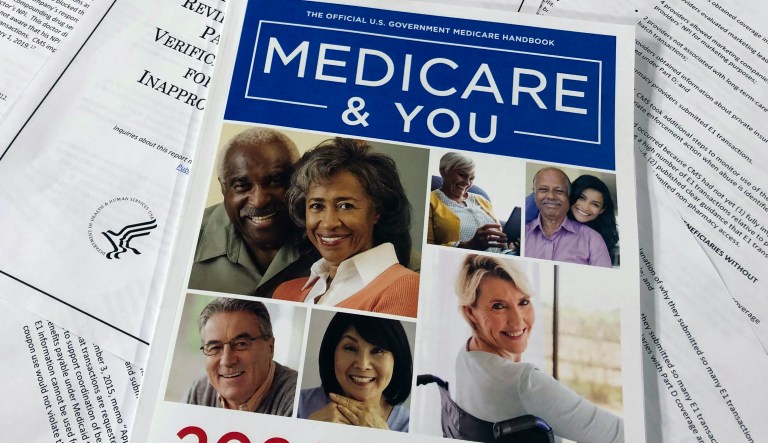 The Official U.S. Government Medicare Handbook for 2020 is placed over pages of a Department of Health and Human Services, Office of the Inspector General report.