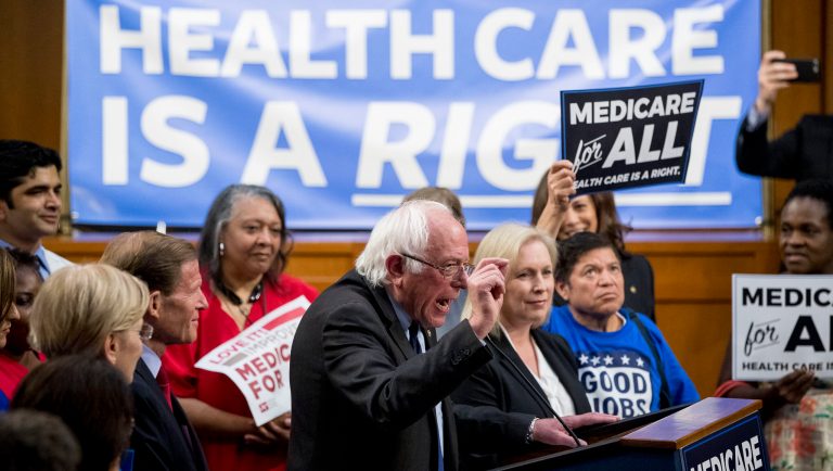 Sen. Bernie Sanders, I-Vt., center, accompanied by Sen. Kirsten Gillibrand, D-N.Y., center right, speaks at a news conference on Capitol Hill in Washington, Wednesday, Sept. 13, 2017, to unveil their Medicare for All legislation to reform health care. 