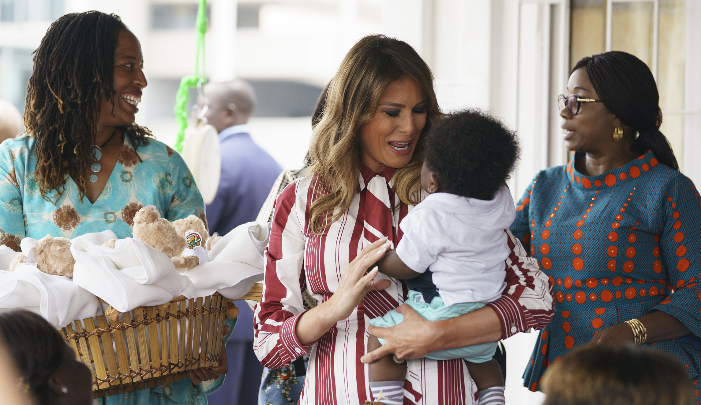 Melania Trump begins Africa trip with a baby in her arms