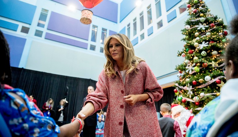 First lady Melania Trump greets patients in the audience after reading "Oliver the Ornament" to children at Children's National Health System, Thursday, Dec. 13, 2018, in Washington.