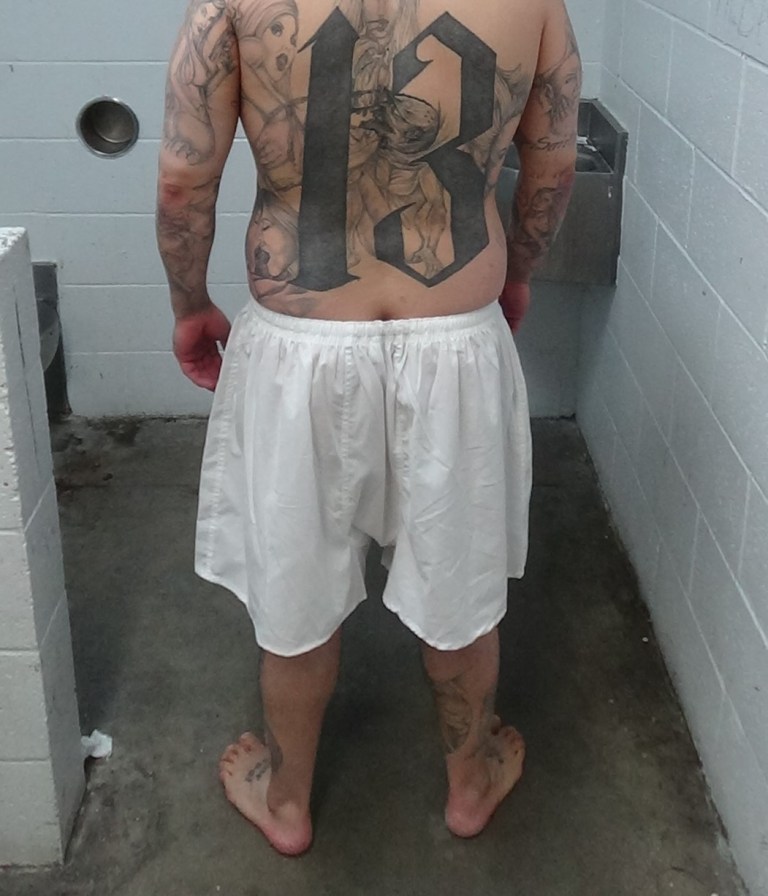 This photograph depicts one of the Mexican Mafia defendants indicted in Orange County on April 27, 2022. The number 13 symbolizes the 13th letter in the alphabet, which is M. 