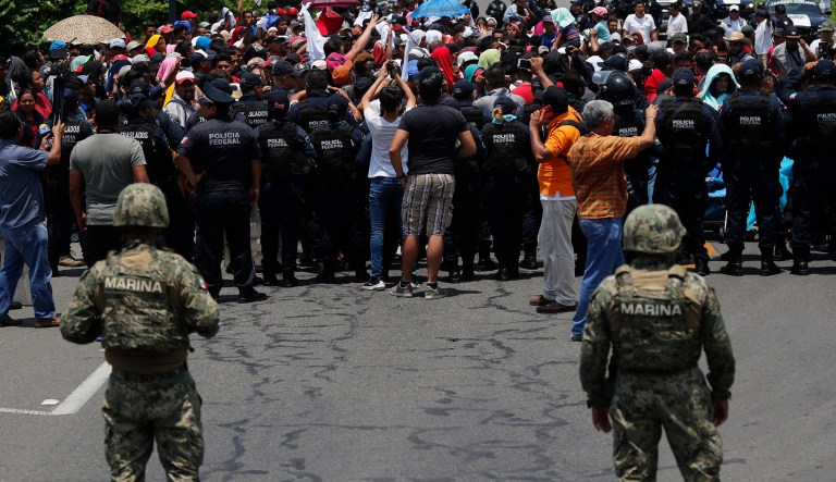 Mexican authorities stop a migrant caravan that had earlier crossed the Mexico - Guatemala border, near Metapa, Chiapas state, Mexico, Wednesday, June 5, 2019. 