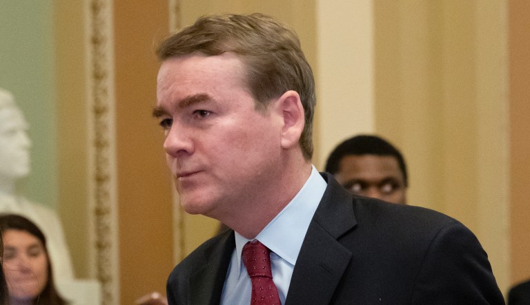 FILE - In this Jan. 24, 2019, file photo, Sen. Michael Bennet, D-Colo., leaves the chamber at the Capitol in Washington. Bennet says he has been diagnosed with prostate cancer as he considers a 2020 Democratic presidential bid.