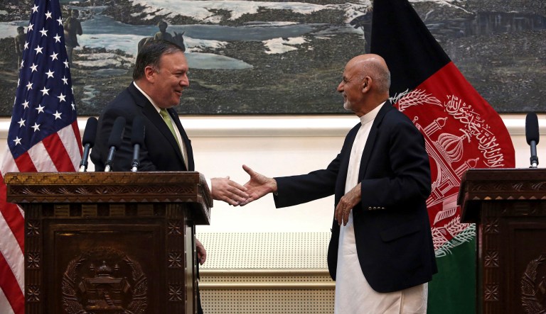 U.S. Secretary of State Mike Pompeo, left and Afghan President Ashraf Ghani, shake hands after a press conference at the presidential palace in Kabul, Afghanistan, Monday, July 9, 2018. Pompeo used an unannounced trip Monday to Afghanistan to step up the Trump administration's calls for peace talks between the Afghan government and the Taliban.