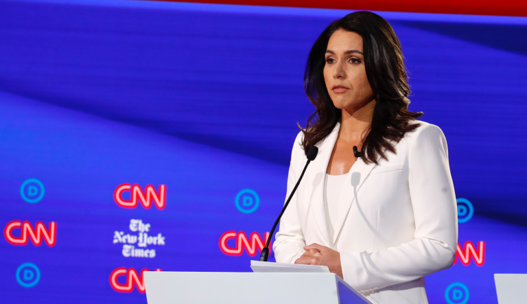 Democratic presidential candidate Rep. Tulsi Gabbard, D-Hawaii, listens during a Democratic presidential primary debate hosted by CNN/New York Times at Otterbein University, Tuesday, Oct. 15, 2019, in Westerville, Ohio. (AP Photo/John Minchillo)