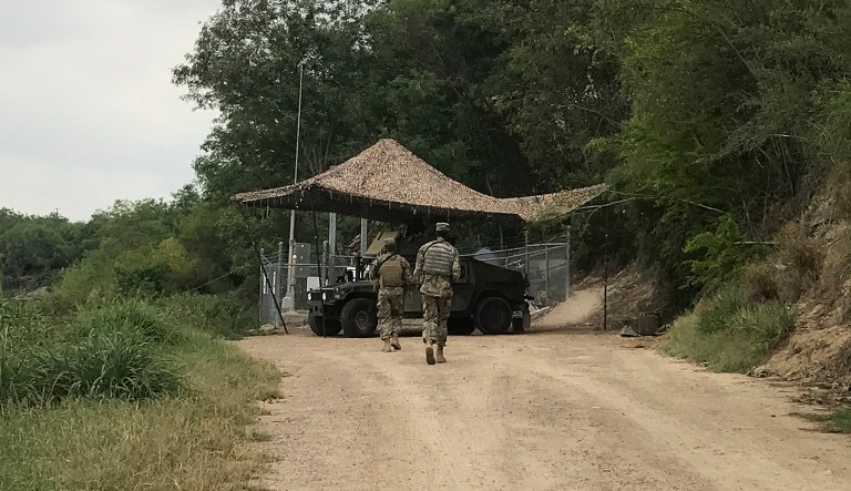 National Guard troops guard the border in Roma, Texas, on Tuesday, April 10, 2018. The deployment of National Guard members to the U.S.-Mexico border at President Donald Trump's request was underway Tuesday with a gradual ramp-up of troops under orders to help curb the flow of illegal immigration.