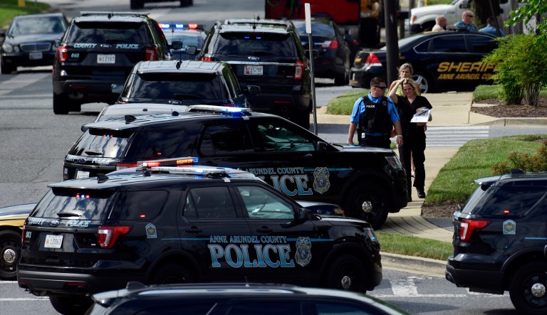 Police secure the scene of a shooting at the building housing The Capital Gazette newspaper in Annapolis, Md., Thursday, June 28, 2018.