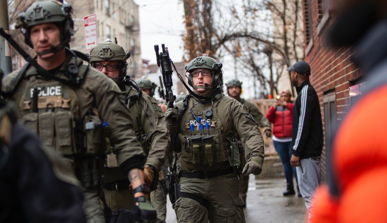 Police officers arrive at the scene following reports of gunfire, Tuesday, Dec. 10, 2019, in Jersey City, N.J. 