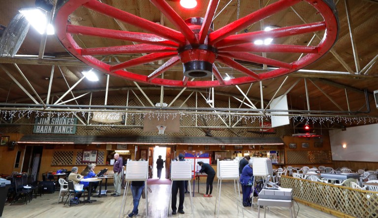 People casts their ballots at the Shaofs Wagon Wheel polling place in Salisbury, N.C., Tuesday, Nov. 6, 2018.