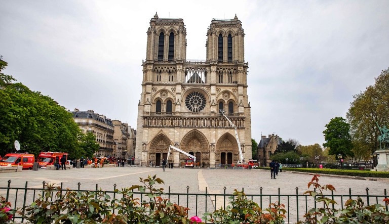 Fire engines sit parked outside the fire-damaged Notre Dame Cathedral in Paris, France, on Tuesday, April 16, 2019.