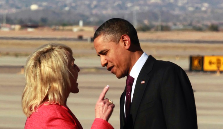 In this Jan. 25, 2012, Arizona Gov. Jan Brewer points during an intense conversation with President Barack Obama after he arrived at Phoenix-Mesa Gateway Airport in Mesa, Ariz.