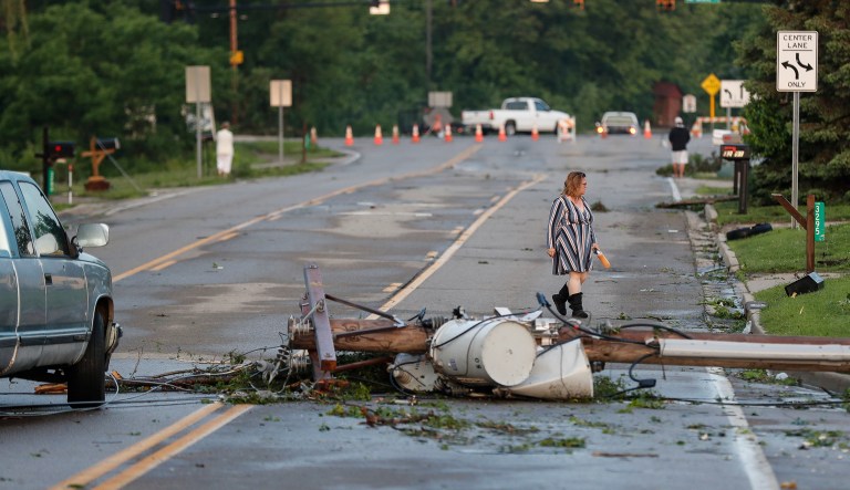 Storm damage litters a residential neighborhood, Tuesday, May 28, 2019, in Vandalia, Ohio. A rapid-fire line of apparent tornadoes tore across Indiana and Ohio overnight, packed so closely together that one crossed the path carved by another.