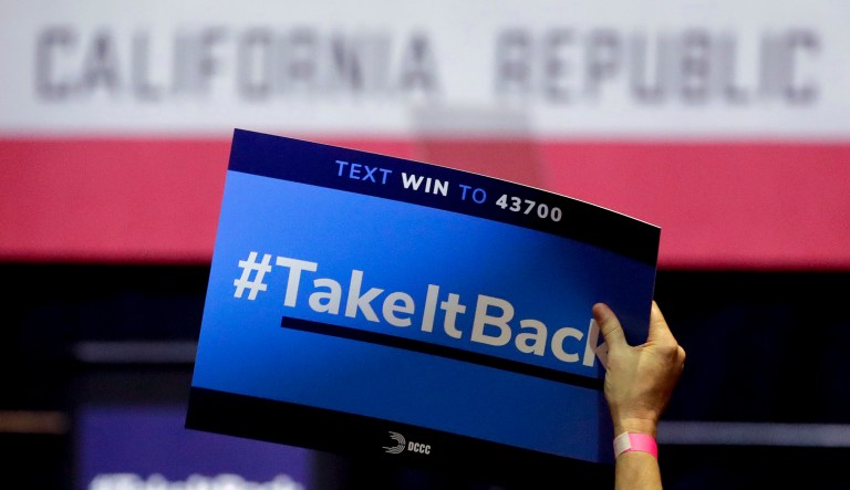 Orange County followed their wallets, not their hearts, in voting blue In this Thursday, Oct. 4, 2018, photo a supporter holds up a sign for Gil Cisneros, a candidate who is running for a U.S. House seat in the 39th District in California, at a rally on the Cal State Fullerton campus in Fullerton, Calif. For decades, Orange County, California, was known as a Republican stronghold but times have changed. A sign of the change is in the 39th District, where, Young Kim, a Korean immigrant Republican is running against Cisneros, a Hispanic Democrat.