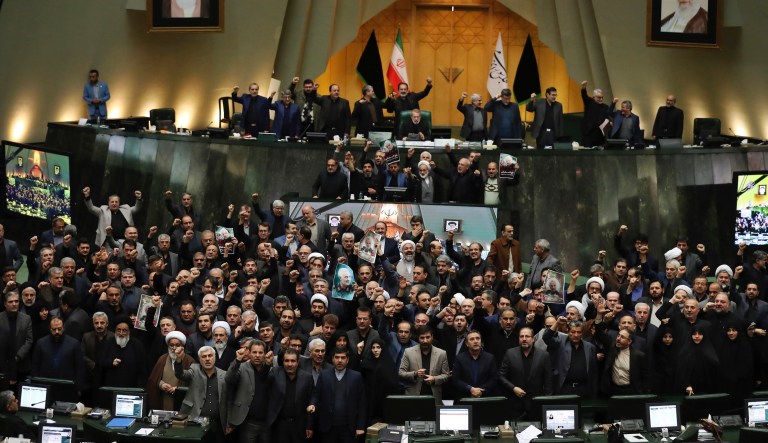 Iranian lawmakers chant slogans including âDeath to Americaâ and âNo compromise! No surrender! Revenge! Revenge!â as some of them hold posters of Gen. Qassem Soleimani, who was killed in Iraq in a U.S. drone attack on Friday, in an open session of parliament, in Tehran, Iran, Tuesday, Jan. 7, 2020. Iran's parliament has passed an urgent bill declaring the U.S. military's command at the Pentagon in Washington and those acting on its behalf âterrorists," subject to Iranian sanctions. The U.S. Defense Department used the Guardâs designation as a terror organization in the U.S. to support the strike that killed Qassem Soleimani, a top guard commander.