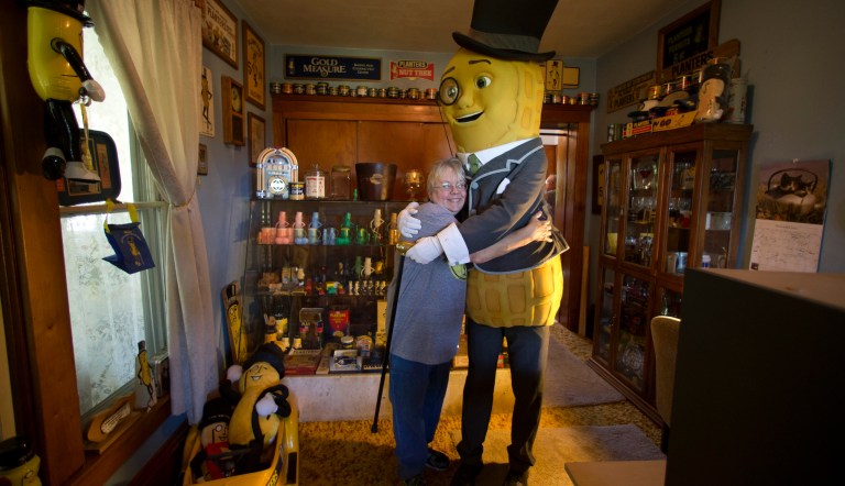 IMAGE DISTRIBUTED FOR PLANTERS - Mr. Peanut super fan Kitty Person, get a surprise visit from the Planter NUTmobile and Mr. Peanut himself in honor of National Peanut Day! on Wednesday, Sept. 9, 2015 in Burlington, Wis. They are shown inside the Person home with Mr. Peanut memorabilia. 