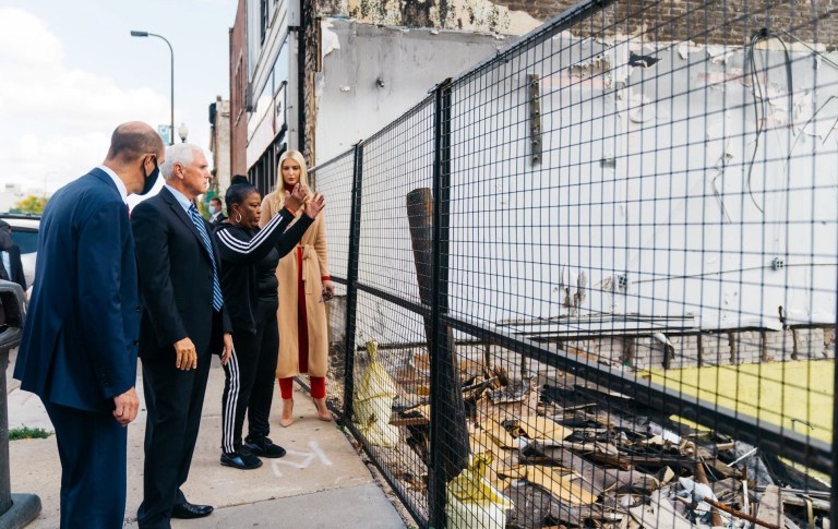 Secretary of Labor Eugene Scalia, Vice President Mike Pence and Ivanka Trump listen as Flora Westrbrooks describes how her business was destroyed during unrest in Minneapolis after the death of George Floyd