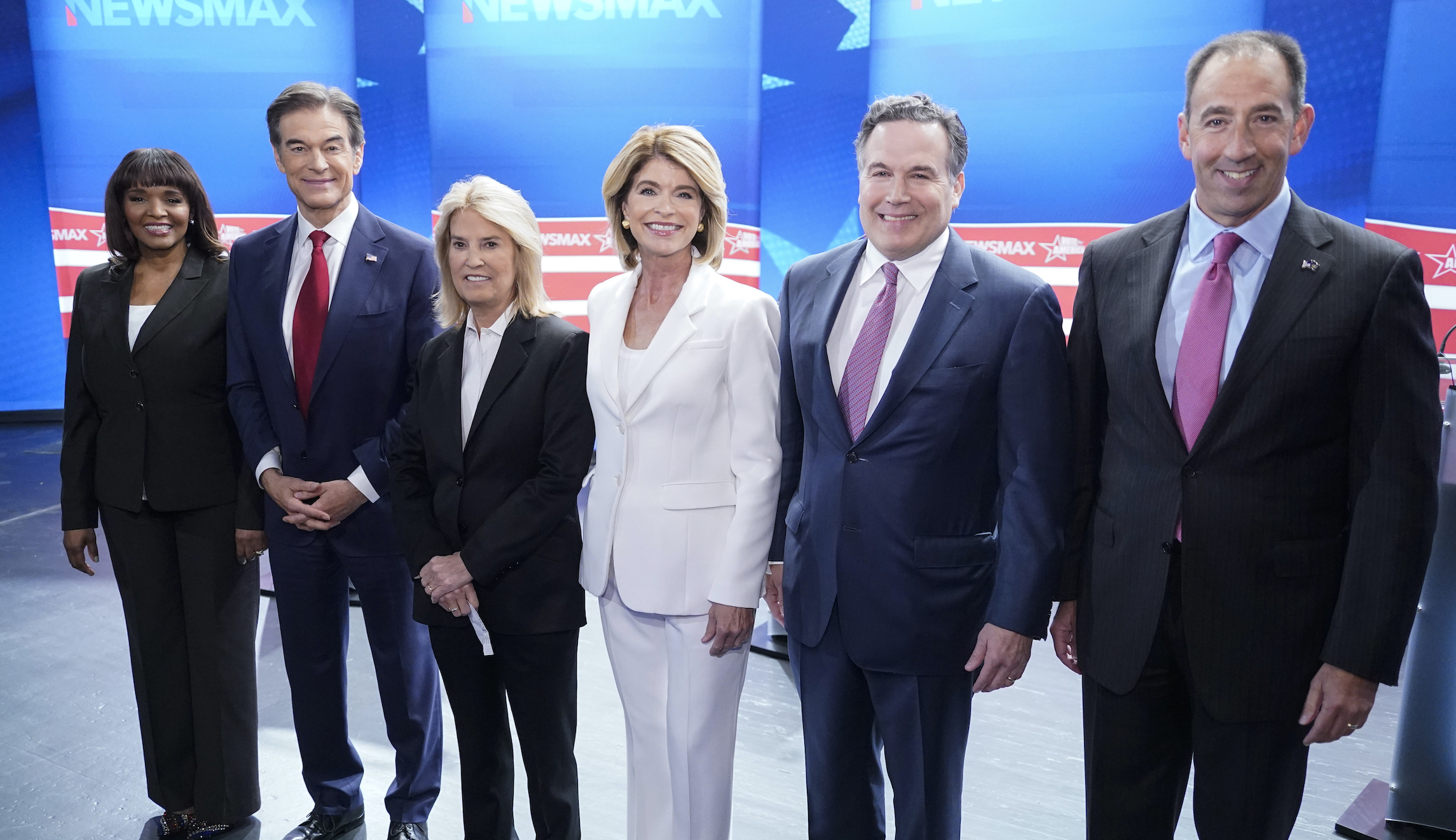 Kathy Barnette, Mehmet Oz, moderator Greta Van Susteren, Carla Sands, David McCormick, and Jeff Bartos, (left to right) pose for a photo before they take part in a debate for Pennsylvania U.S. Senate Republican candidates on May 4, 2022, in Grove City, Pennsylvania.