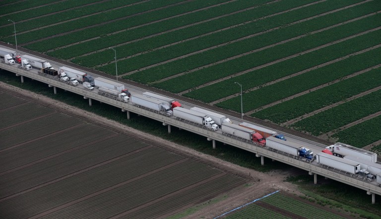 Trucks wait in line on the Pharr International bridge near the Texas-Mexico border, Tuesday, Feb. 24, 2015, in Pharr, Texas.