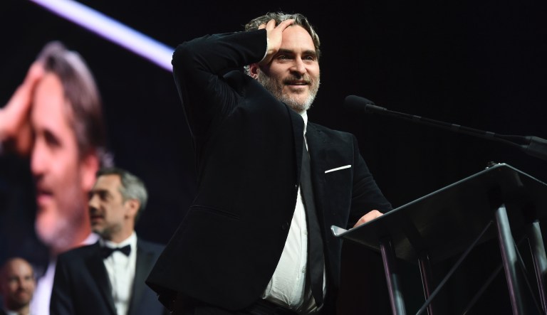 Joaquin Phoenix reacts as he accepts the chairman's award for his role in "Joker" at the 31st annual Palm Springs International Film Festival Awards Gala on Thursday, Jan. 2, 2020, in Palm Springs, Calif. 