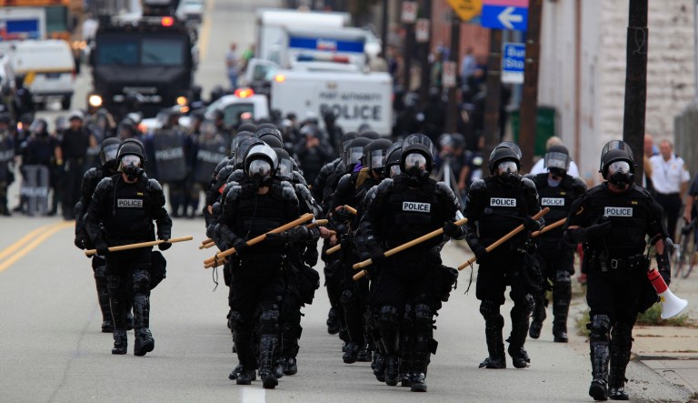 Pittsburgh police in riot gear redeploy after confrontations with protestors near the Strip District in Pittsburgh, Thursday Sept. 24, 2009. Hundreds of demonstrators marched in protest of the G20, which is expected to begin in Pittsburgh on Thursday.