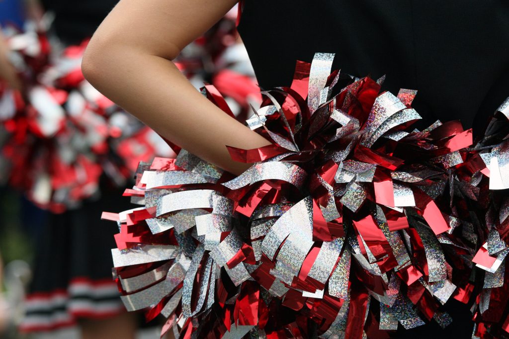 Cheerleaders apologize after harassing rivals with ‘privilege’ sign