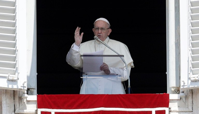 FILE - In this Aug. 5, 2018, file photo Pope Francis delivers a blessing from his studio window overlooking St. Peter's Square at the Vatican. Pope Francis' decree that the death penalty is "inadmissible" in all cases could pose a dilemma for Roman Catholic politicians and judges in the United States. Some Catholic leaders in death penalty states have said they'll continue to support capital punishment, despite the change in church teaching.
