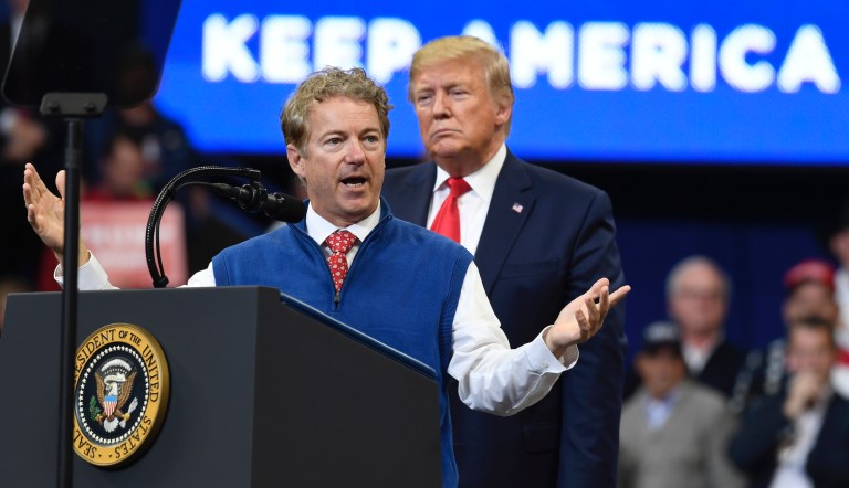 President Donald Trump listens as Sen. Rand Paul, R-Ky., speaks during a campaign rally in, Lexington, Ky., Monday, Nov. 4, 2019. 