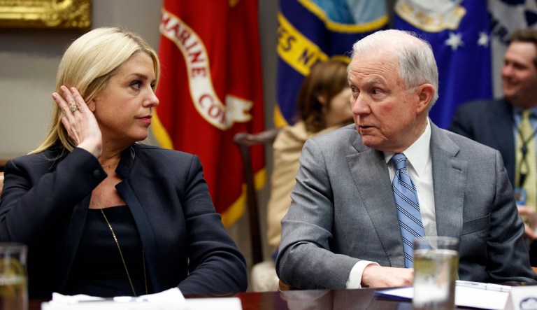 Attorney General Jeff Sessions, right, talks with Florida Attorney General Pam Bondi before a meeting with President Donald Trump and state and local officials to discuss school safety, in the Roosevelt Room of the White House, Thursday, Feb. 22, 2018, in Washington. 