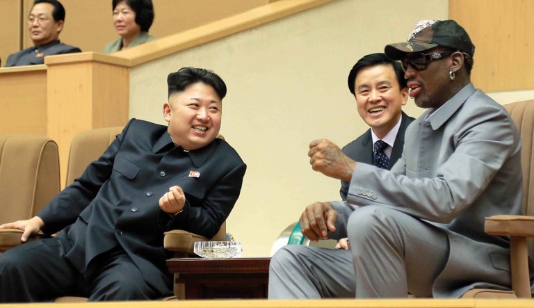 In this Jan. 8, 2014 photo provided by the North Korean government, North Korean leader Kim Jong Un, left, talks with former NBA player Dennis Rodman, right, as they watch an exhibition basketball game at an indoor stadium in Pyongyang. North Korea is expecting another visit by former NBA bad boy Rodman on Tuesday, June 13, 2017,  in what would be his first to the country since President Donald Trump took office. Independent journalists were not given access to cover the event depicted in this photo.