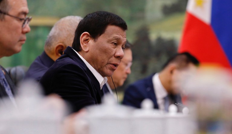 Philippine President Rodrigo Duterte (2-L) speaks to Chinese Premier Li Keqiang (not pictured) during their meeting at the Great Hall of the People in Beijing, China, 30 August 2019. 