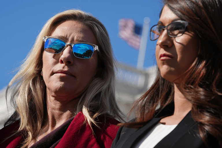 Reps. Marjorie Taylor Greene, R-Ga., left, and Lauren Boebert, R-Colo., attend a news conference with the House Freedom Caucus to oppose the Democrats' tax and spend package, outside of the Capitol on November 3, 2021. 