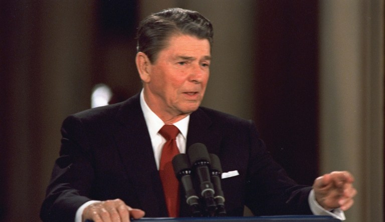 President Reagan is shown responding to a reporter's question during his news conference at the White House, March 19, 1987.
