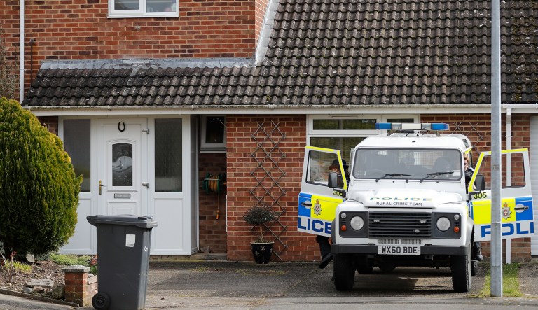 A police vehicle is parked outside the house of former Russian double agent Sergei Skripal who was found critically ill Sunday following exposure to an "unknown substance" in Salisbury, England, Tuesday, March 6, 2018. Skripal, and an unidentified woman companion are being treated in hospital, after they were found unconscious on a  bench in the town.