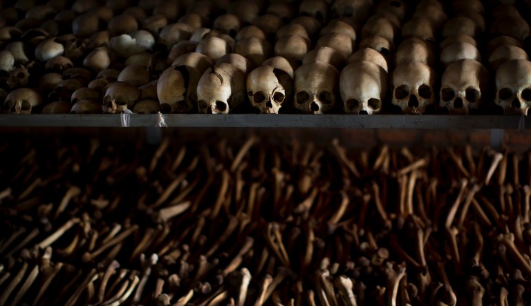 FILE - In this Friday, April 4, 2014 file photo, the skulls and bones of some of those who were slaughtered as they sought refuge inside the church are laid out as a memorial to the thousands who were killed in and around the Catholic church during the 1994 genocide in Ntarama, Rwanda. Felicien Kabuga, one of the most wanted fugitives in Rwanda's 1994 genocide who had a $5 million bounty on his head, has been arrested in Paris, authorities said Saturday, May 16, 2020.