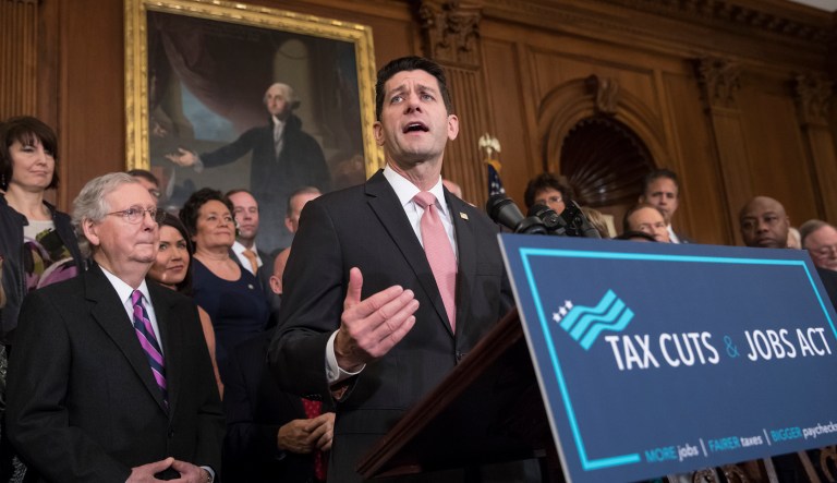 Speaker of the House Paul Ryan, R-Wis., joined at left by Senate Majority Leader Mitch McConnell, R-Ky., praises the Republican tax bill at an enrollment ceremony at the Capitol in Washington, Thursday, Dec. 21, 2017.