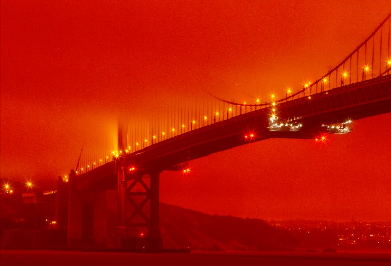 Skies in western US turn orange and red as air becomes thick with wildfire smoke