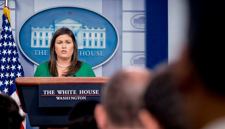 White House press secretary Sarah Huckabee Sanders reads a statement from President Donald Trump announcing that he will remove the security clearance from former CIA Director John Brennan during the daily press briefing at the White House, Wednesday, Aug. 15, 2018, in Washington. Sanders said the president will be reviewing the security clearances for a number of other former officials.