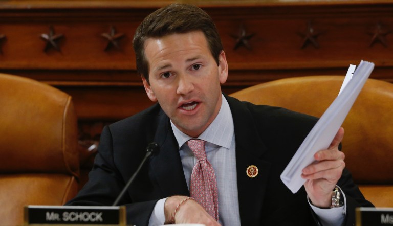 Rep. Aaron Schock, R-Ill., questions ousted IRS Chief Steve Miller and J. Russell George, Treasury Inspector General for Tax Administration, as they testify during a hearing at the House Ways and Means Committee on the Internal Revenue Service (IRS) practice of targeting applicants for tax-exempt status based on political leanings on Capitol Hill, in Washington, Friday, May 17, 2013. 