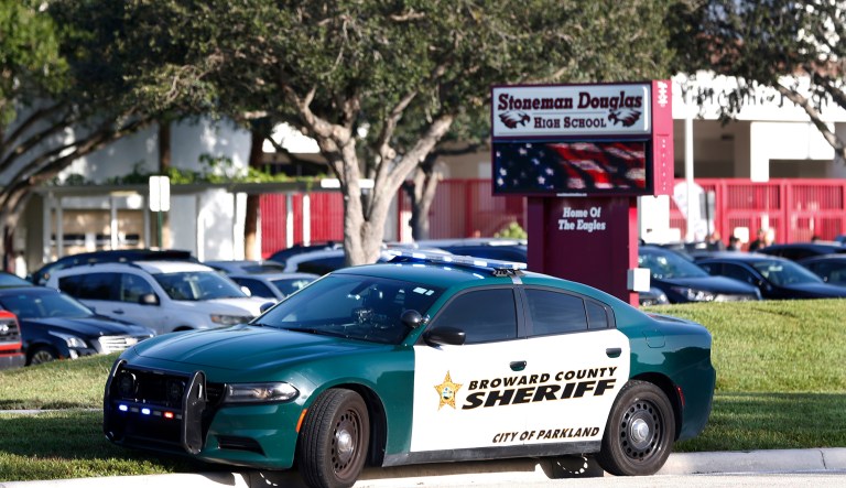 FILE - In an Aug. 15, 2018 file photo, a Broward County Sheriff's Office vehicle is parked outside Marjory Stoneman Douglas High School, in Parkland, Fla. Floridaâs top incoming legislative leaders are rejecting Gov. Rick Scottâs push to redirect $58 million so school districts can hire more campus police officers. House Speaker-elect Jose Oliva and incoming Senate President-elect Bill Galvano, both Republicans, said Wednesday, Aug, 22, 2018 that the money should remain budgeted for the stateâs guardian program.