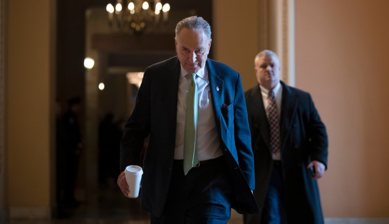 Senate Minority Leader Chuck Schumer, D-N.Y., returns to his office at the Capitol in Washington, Wednesday, Jan. 23, 2019. The Senate will vote on two competing proposals this week to end the partial government shutdown, but neither seems to have enough votes to advance. 