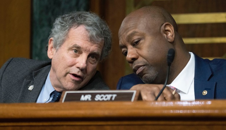 Senate Banking, Housing and Urban Affairs Chairman Sherrod Brown, D-Ohio, left, and ranking member Tim Scott, R-S.C. talk during a hearings to examine recent bank failures and the Federal regulatory response, Tuesday, March 28, 2023, on Capitol Hill, in Washington. 