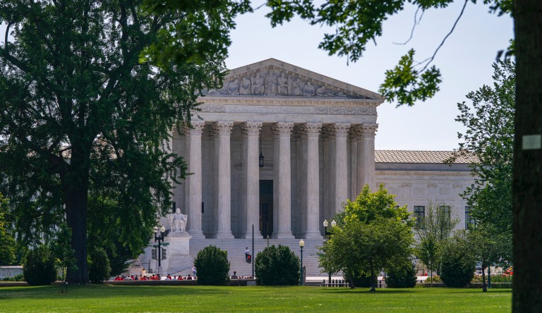 The Supreme Court is framed by trees as the justices prepare final decisions of the high court's term, in Washington, Monday, June 24, 2019.                                                                                                                                                                                                                                                                                                                                                                                   