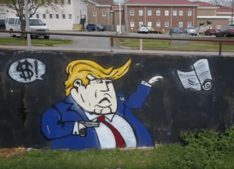 Alabama city paints over mural of Trump shooting school children