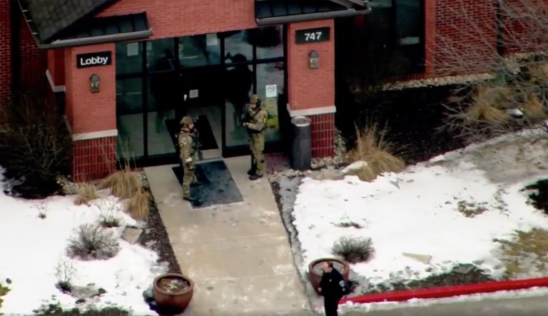 SWAT in standoff with suspect in death of US marshal