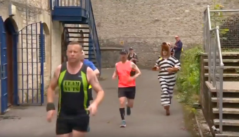 Runners use abandoned prison for marathon