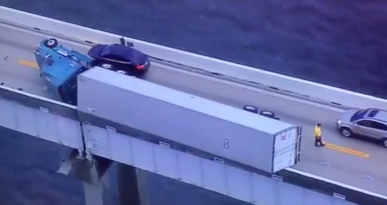 Overturned tractor-trailer clings to edge of Bay Bridge, stalls traffic for hours